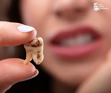 A woman holding an infected tooth